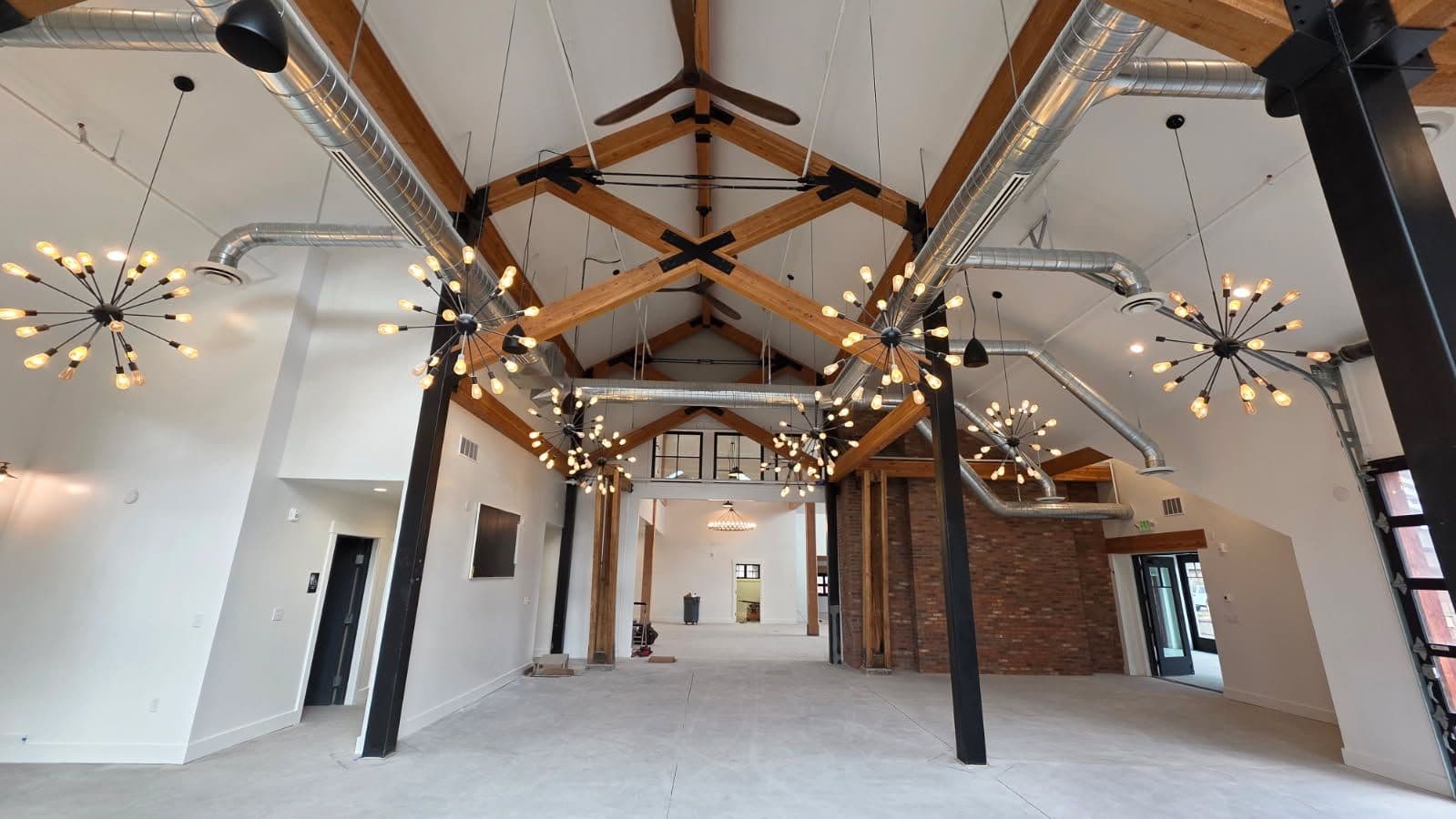 Modern Industrial Interior with Exposed Beams and Ductwork image